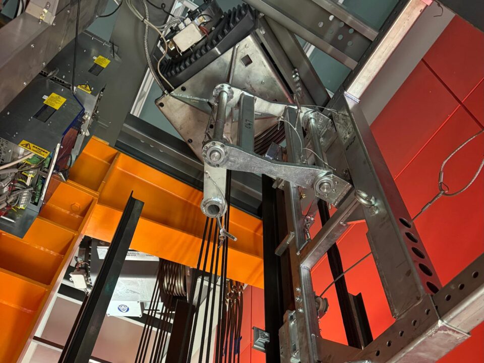 Lift machinery, ropes and steelwork inside a lift shaft