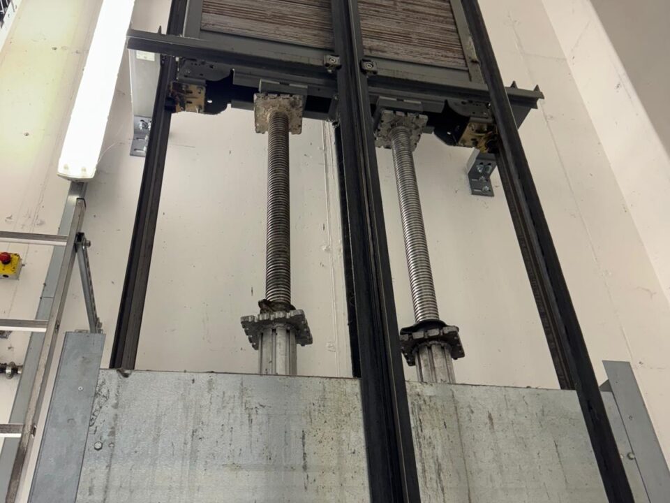 Hydraulic lift equipment and guide rails inside a lift shaft